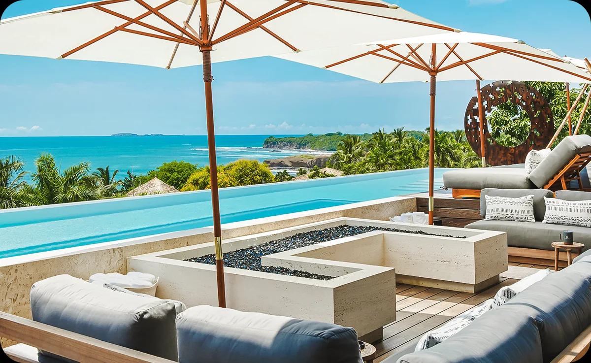 Ocean-view pool terrace with lounge seating