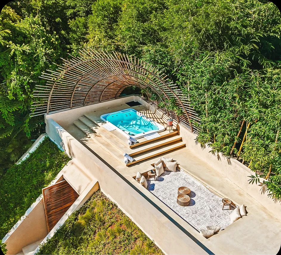 A secluded jacuzzi nestled in the gardens